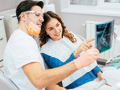 dentist reviewing xray with patient